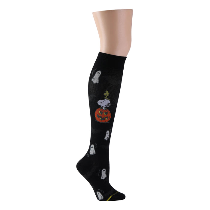 Black knee-high compression socks featuring Peanuts characters on a mountain hike design.