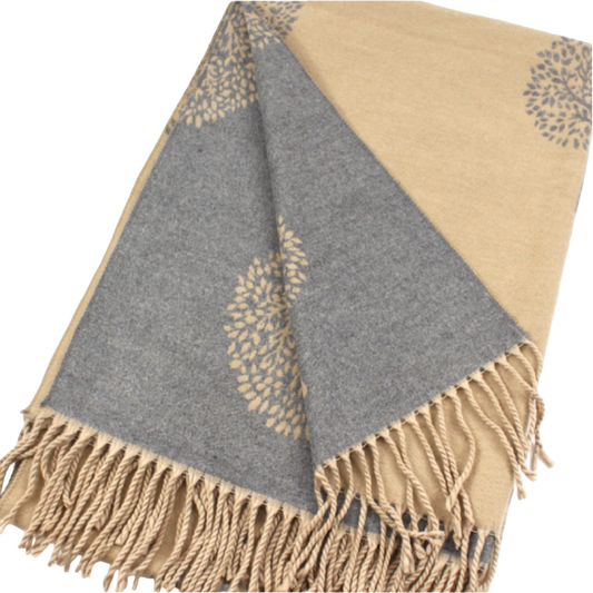 Khaki and gray reversible scarf folded to show contrasting tree motifs on both sides, with khaki fringe at the ends.
